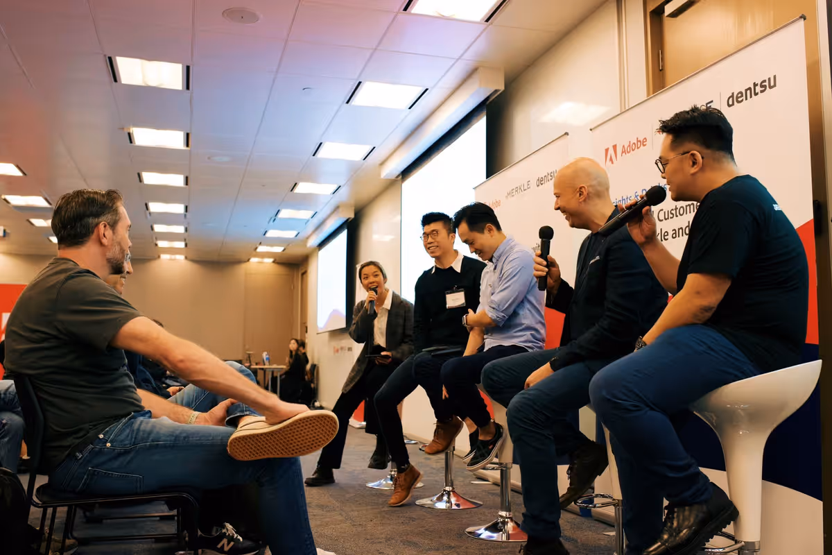 Consulting team collaborating around a table in a modern office.